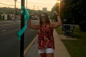 Lincroft NJ Woman Teal Ribbon Sign